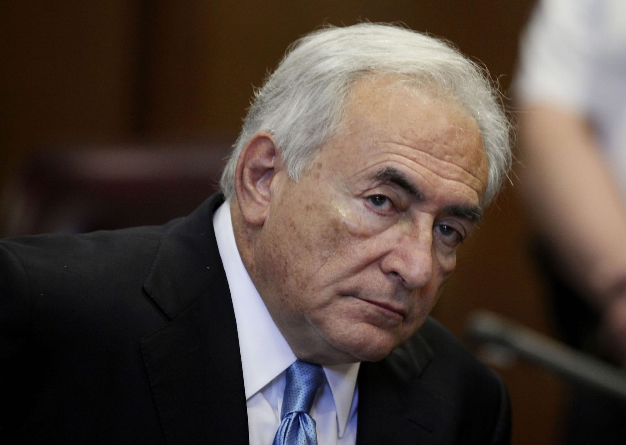 Former International Monetary Fund leader Dominique Strauss-Kahn listens to proceedings in New York State Supreme court in New York in 2011.