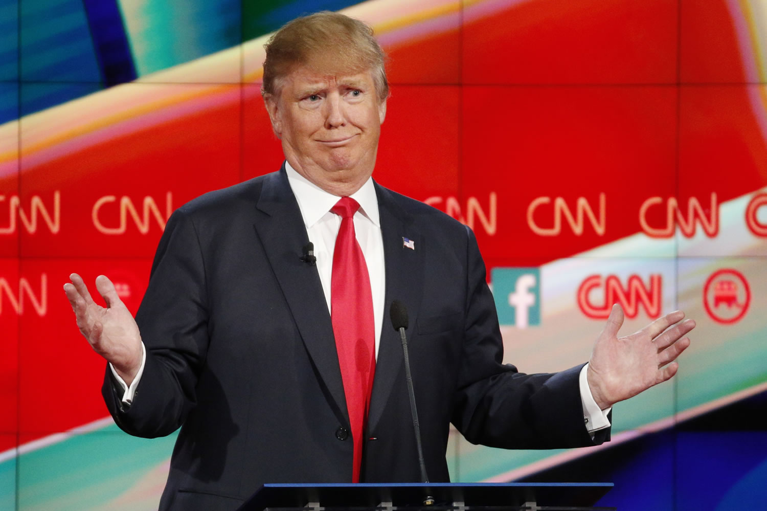 Donald Trump reacts Tuesday during the CNN Republican presidential debate at the Venetian Hotel &amp; Casino in Las Vegas.
