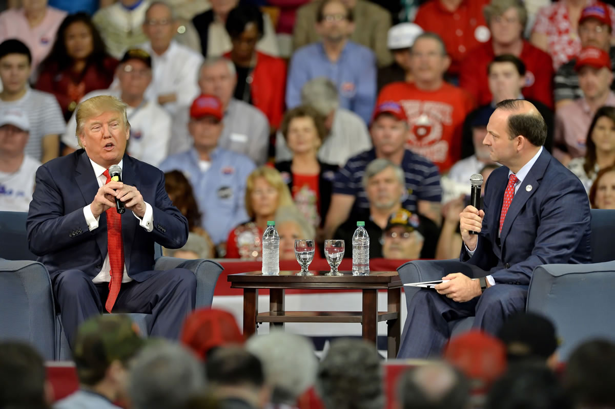 Republican presidential candidate Donald Trump answers questions from South Carolina Attorney General Alan Wilson, right, at a town hall meeting in the Convocation Center on the University of South Carolina Aiken campus Saturday, Dec. 12, 2015, in Aiken, S.C.