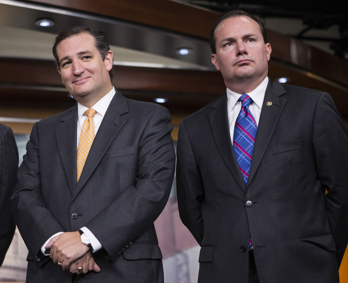 Sen. Ted Cruz, R-Texas, left, and Sen. Mike Lee, R-Utah, stand Thursday during a news conference with conservative Congressional Republicans at the Capitol in Washington.