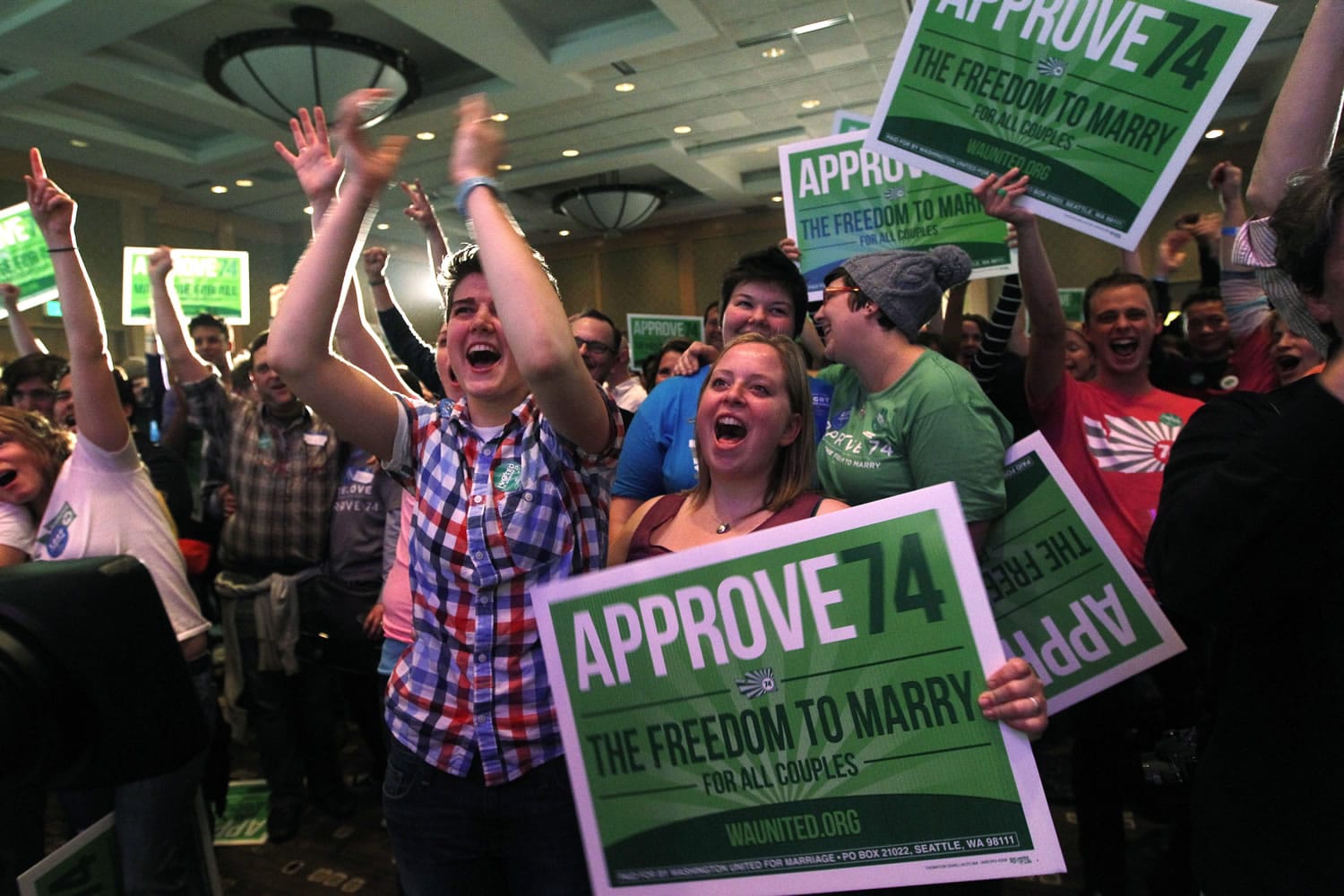 Supporters cheer at an election watch party for proponents of Referendum 74, which would uphold the state's new same-sex marriage law, Tuesday in Seattle.