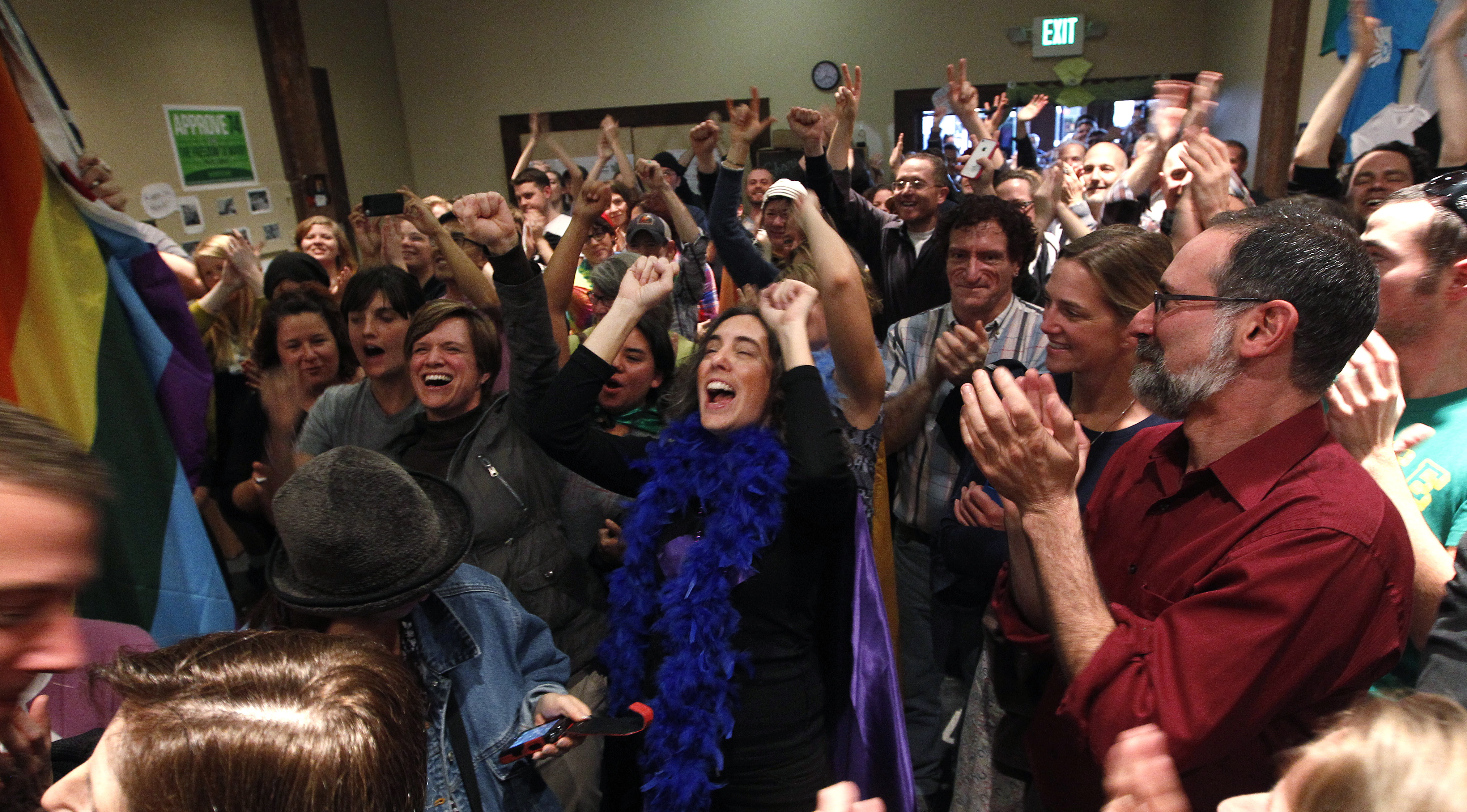 Supporters of Referendum 74, which would uphold the state's new same-sex marriage law, cheer at a news conference Wednesday in Seattle.