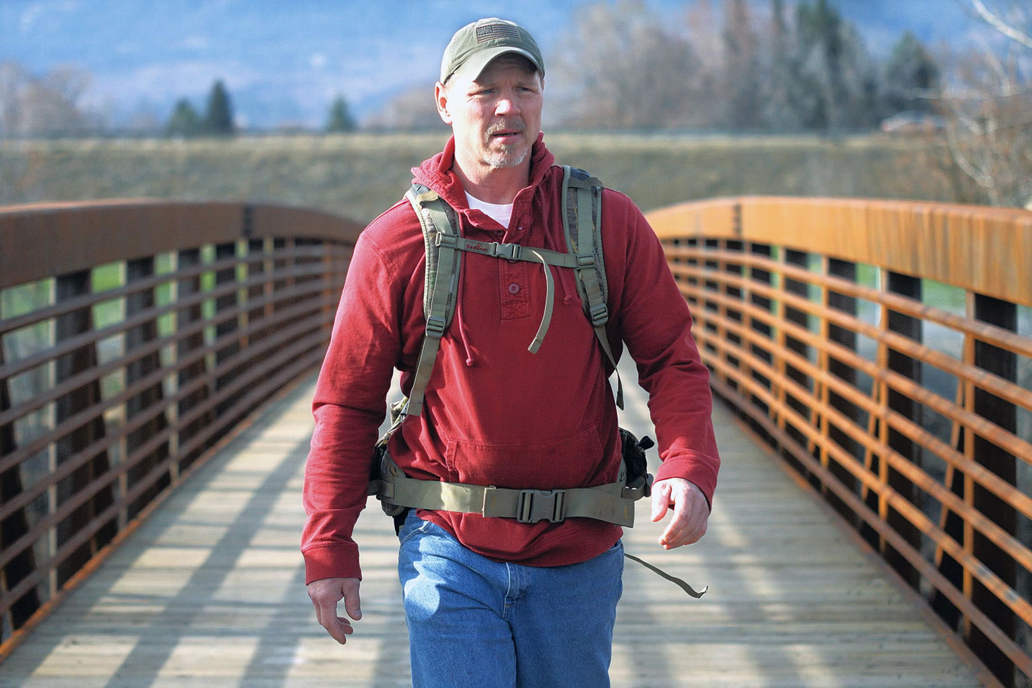 Chris Baxter/The Observer (La Grande, Ore.)
Joe Bell crosses a bridge at Riverside Park in La Grande, Ore., on March 19 in his preparations to walk across the United States to honor his late son, Jadin, and promote an anti-bullying program. Bell, the father of a gay Oregon teenager from who hanged himself is ready to begin walking across the United States to spread his message against bullying.