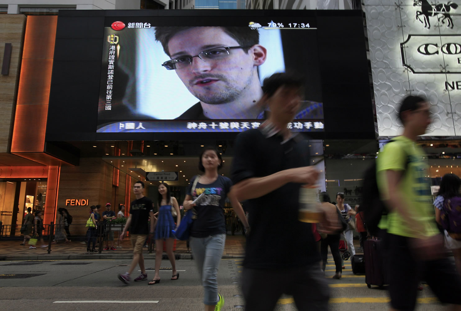 A TV screen shows a news report of Edward Snowden, a former CIA employee who leaked top-secret documents about sweeping U.S. surveillance programs, at a shopping mall in Hong Kong on June 23. The saga of Edward Snowden and the NSA makes one thing clear: The United States' central role in developing the Internet and hosting its most powerful players has made it the global leader in the surveillance game .