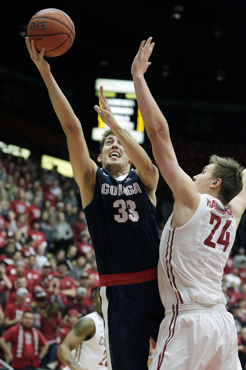 Gonzaga&#039;s Kyle Wiltjer (33) takes a shot while under pressure from Washington State&#039;s Josh Hawkinson (24) during the first half Wednesday in Pullman.