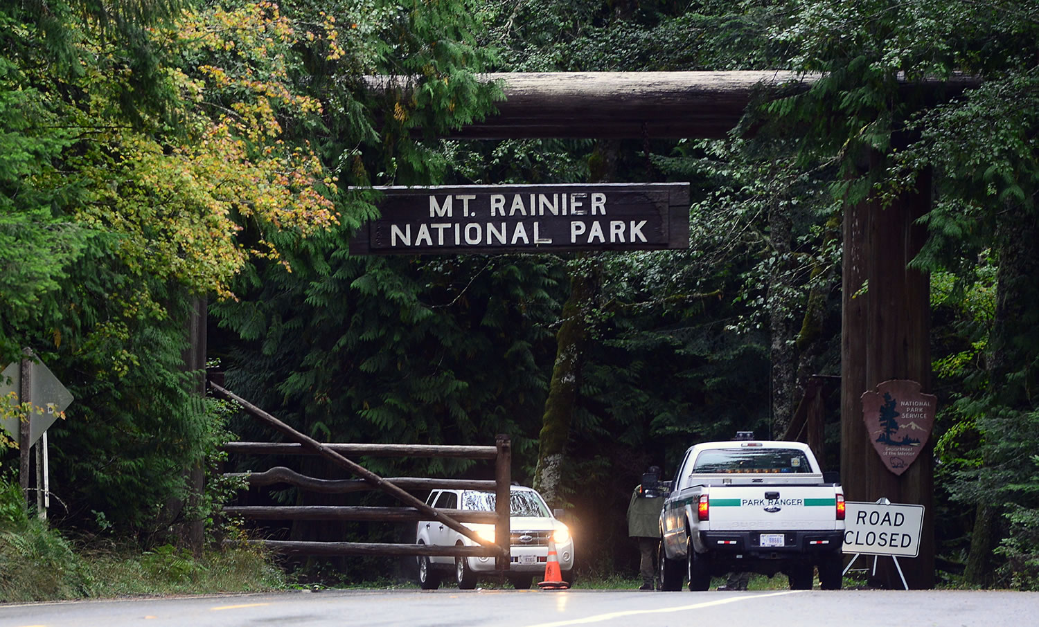 Pete Caster/The Chronicle/AP - Mt. Rainier National Park personnel close the gate to the park near Ashford on the afternoon of Oct. 1.
