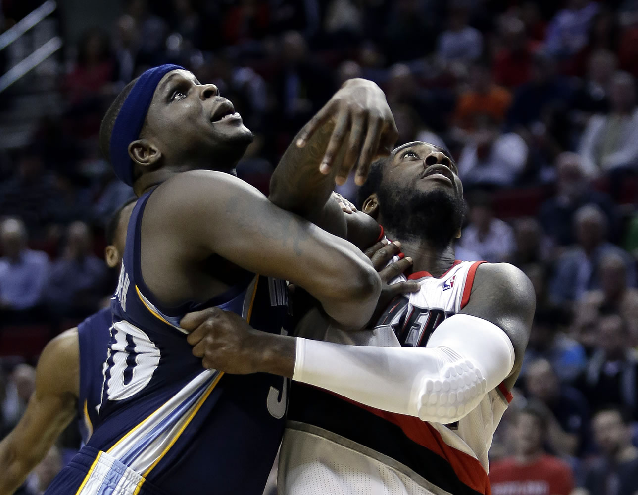 Memphis Grizzlies forward Zach Randolph, left, and Portland Trail Blazers forward J.J. Hickson battle for position under the basket for a rebound during the second half Wednesday.
