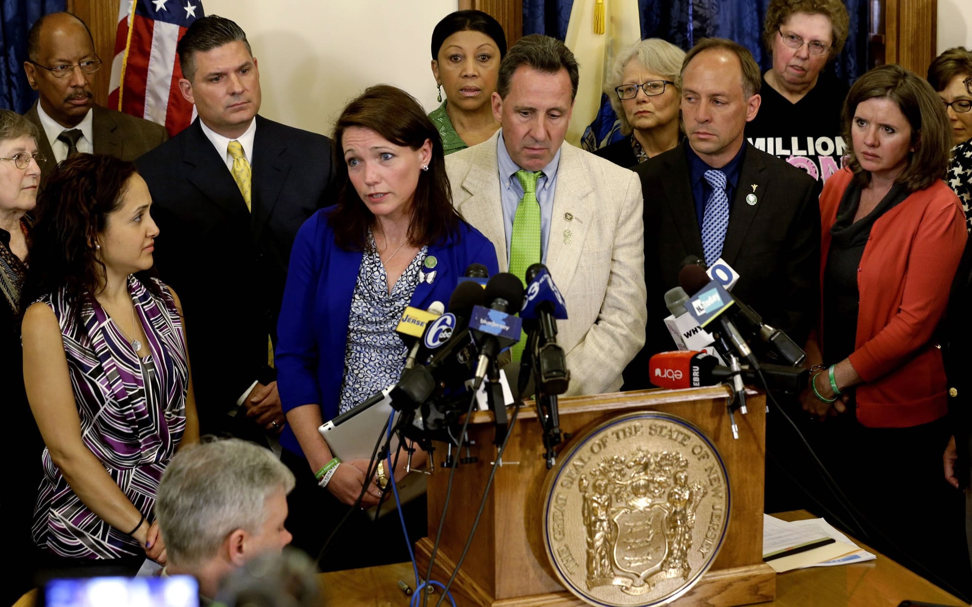 Nicole Hockley and other parents of victims of the Sandy Hook elementary school shooting talk to media at the New Jersey Statehouse in Trenton on April 30, where they joined gun control advocates to ask the state and Gov.