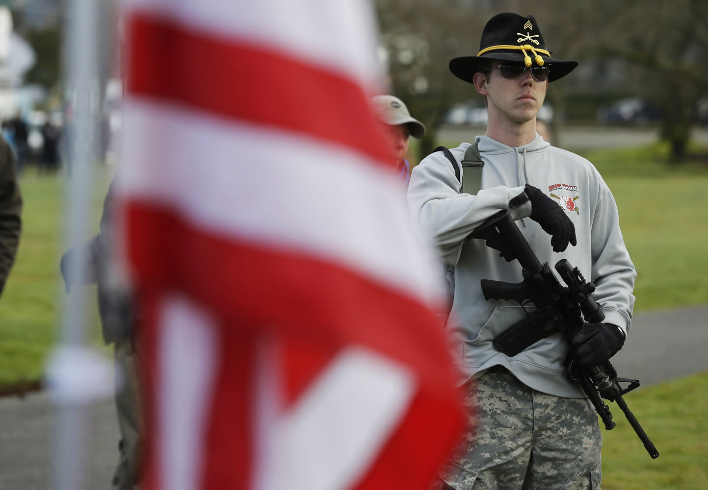 Ryan Brooks of Shelton holds his AR-15 rifle as he attends a gun rights rally Friday at the Capitol in Olympia.