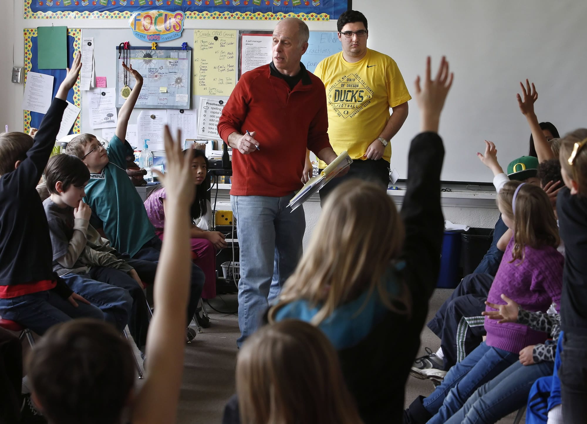 University of Oregon philosophy instructor Paul Bodin and UO student Kevin Keiter engage a fourth-grade class at Edison Elementary School in a philosophy discussion in Eugene, Ore.
