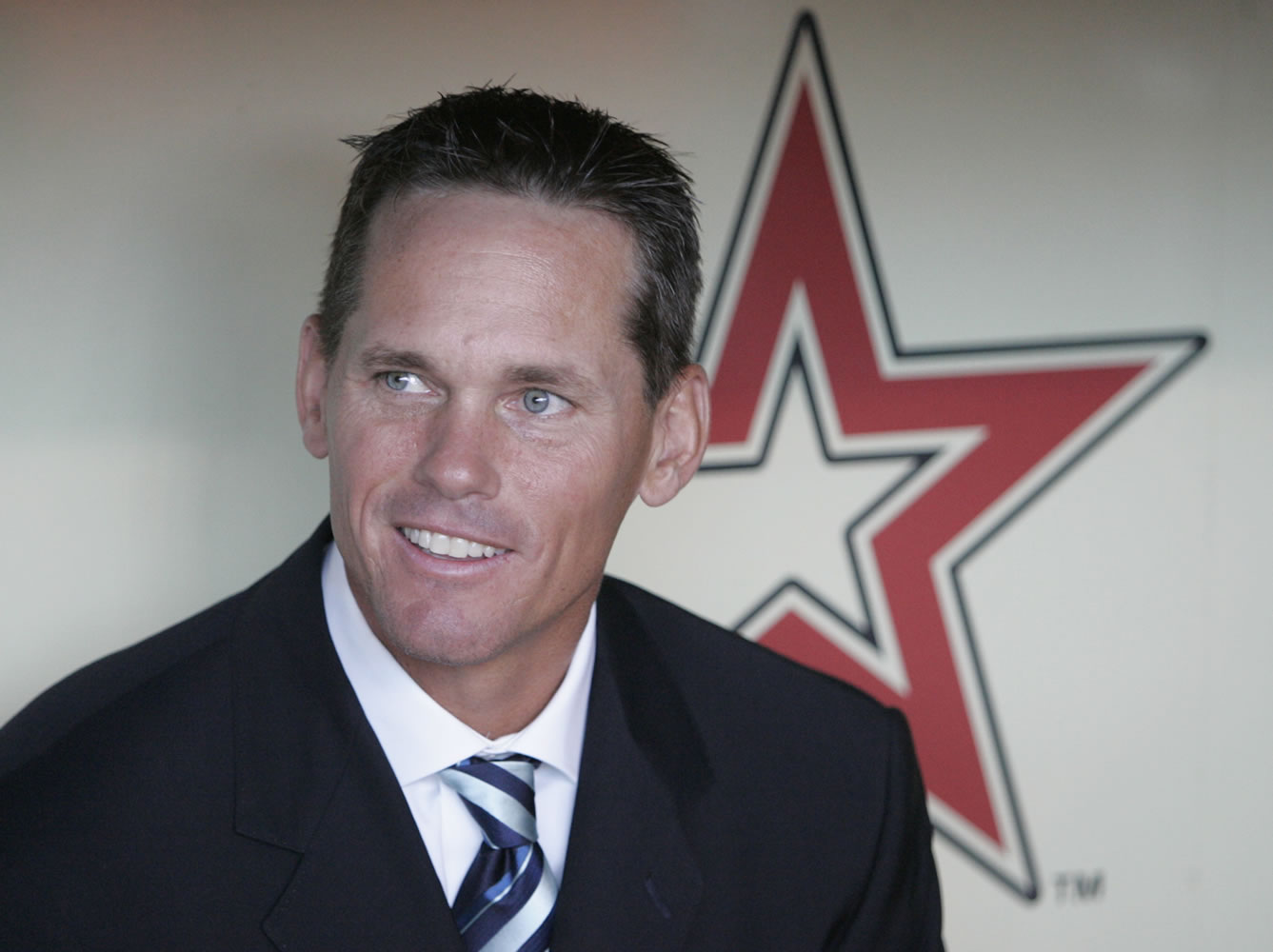 FILE - This is an Aug. 17, 2008 file photo shows former Houston Astros baseball player Craig Biggio sitting in the dugout during his introduction at his number retirement ceremony in Houston. Steroid-tainted stars Barry Bonds, Roger Clemens and Sammy Sosa have been denied entry to baseball's Hall of Fame with voters failing to elect any candidates for only the second time in four decades. Biggio, 20th on the career list with 3,060 hits, topped the 37 candidates with 68.2 percent of the 569 ballots, 39 shy of the 75 percent needed.