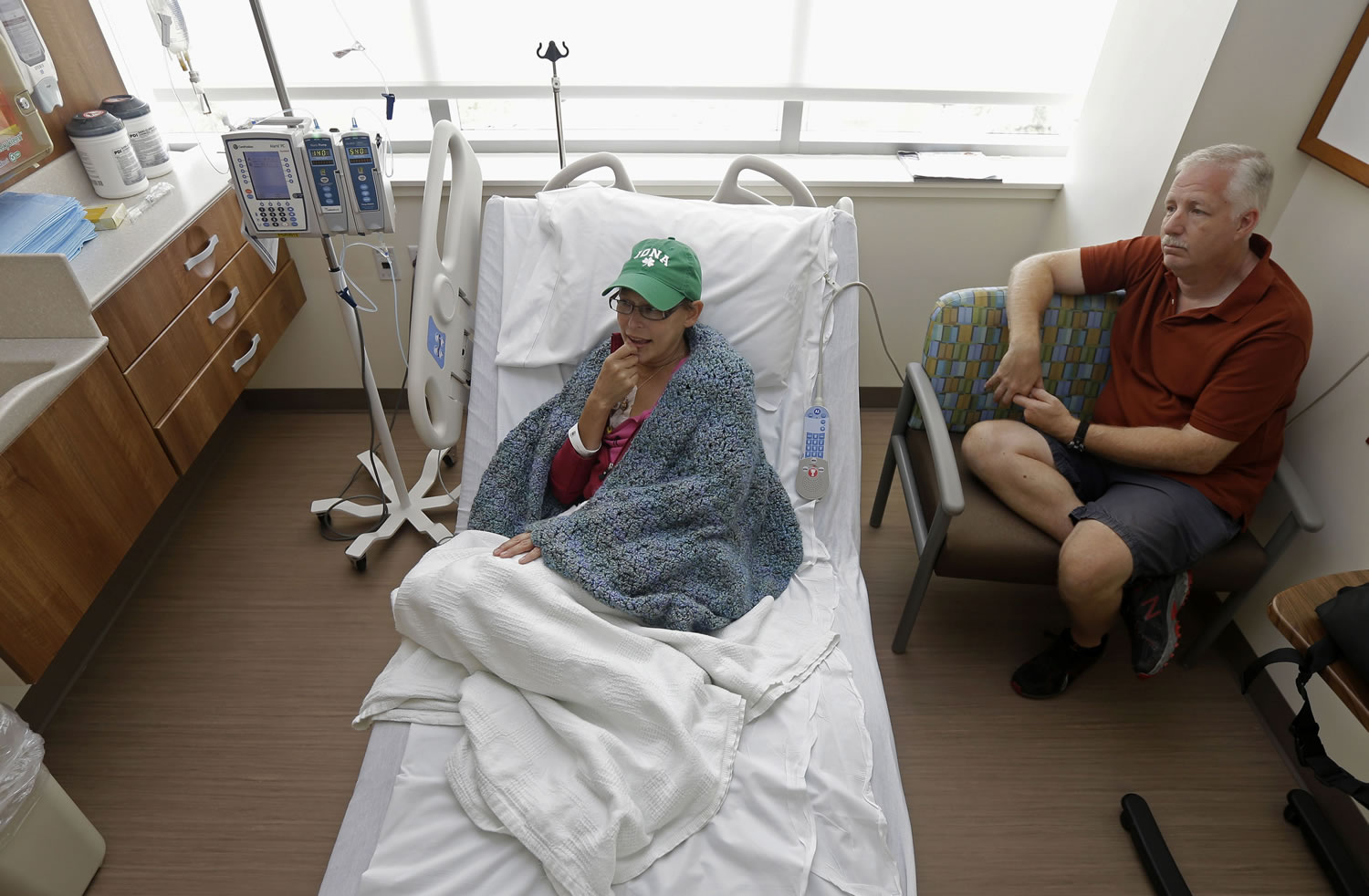 Bev Veals, left, undergoes chemotherapy treatment, accompanied by her husband, Scott, at Duke Cancer Center in Durham, N.C.