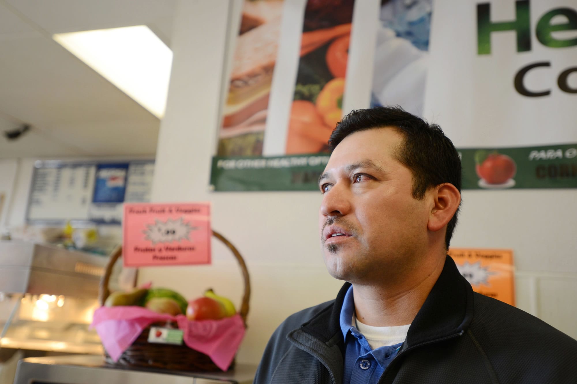 Come N Go owner Isaias Hernandez sells more healthful food options at his Woodburn, Ore., corner store on Oct. 18.