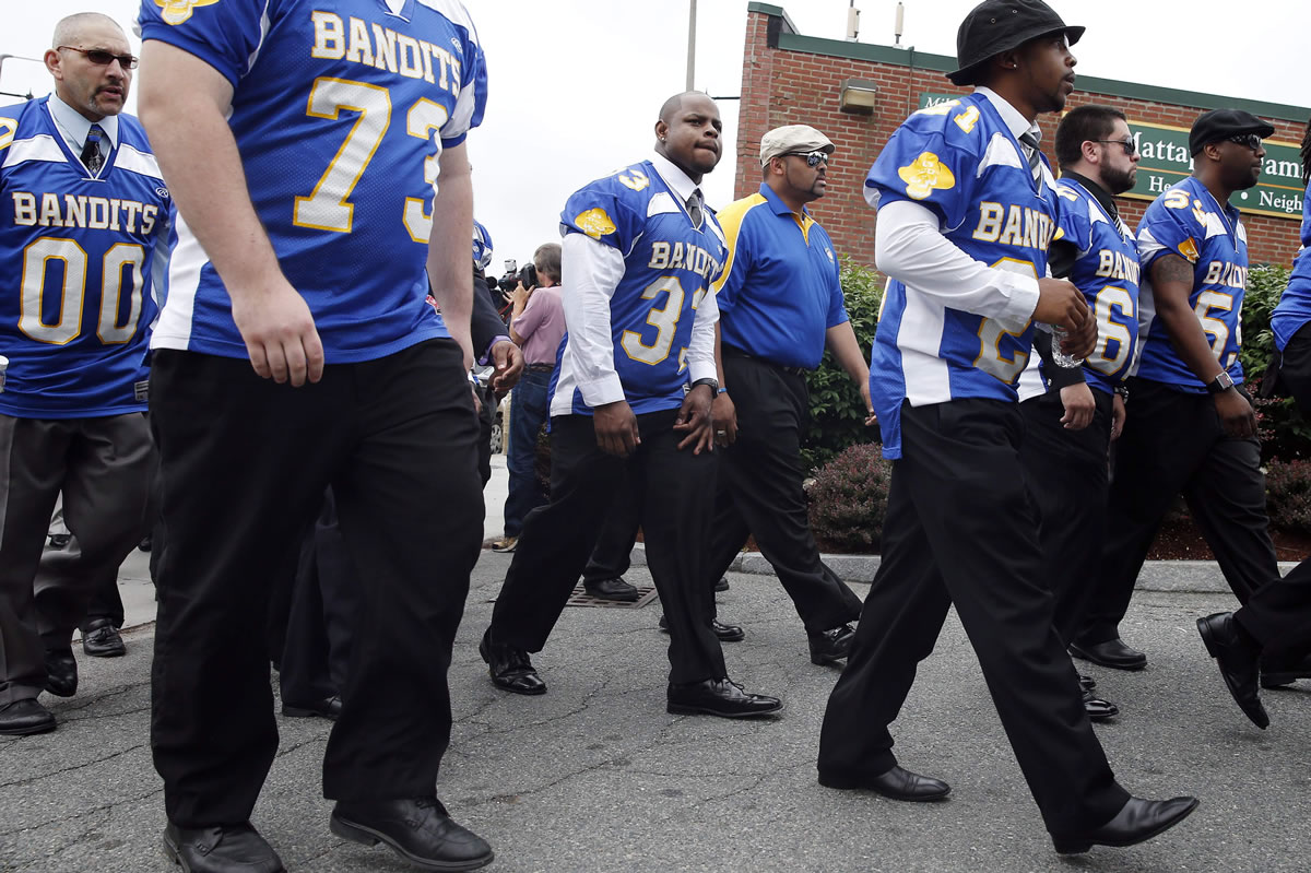 Odin Lloyd's teammates arrive for Lloyd's funeral service at Church of the Holy Spirit in Boston on Saturday.