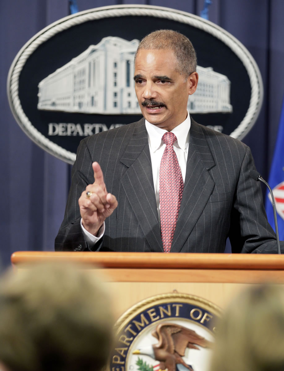 Attorney General Eric Holder speaks during a news conference at the Justice Department in Washington.