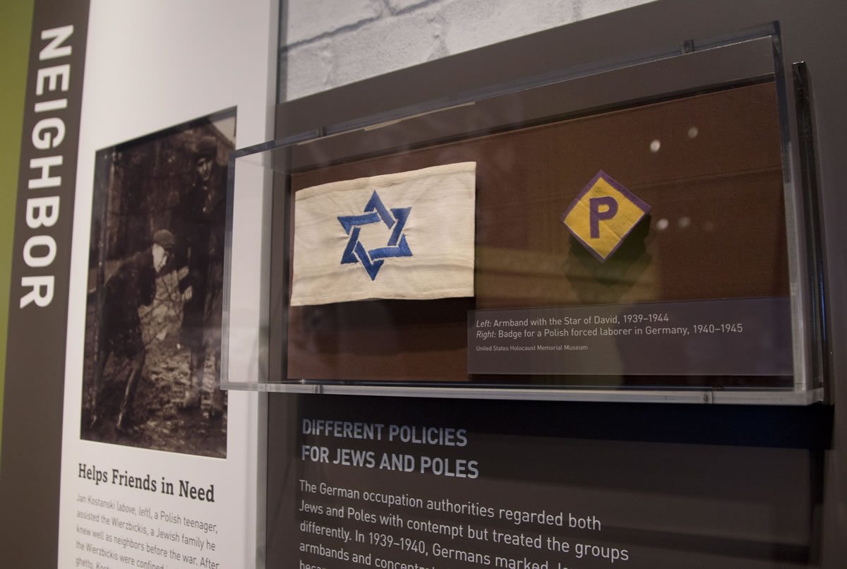 An armband with the Star of David and a badge for a forced laborer in Germany at the United States Holocaust Memorial Museum during a preview of the new exhibit &quot;Some Were Neighbors: Collaboration &amp; Complicity in the Holocaust&quot; in Washington.