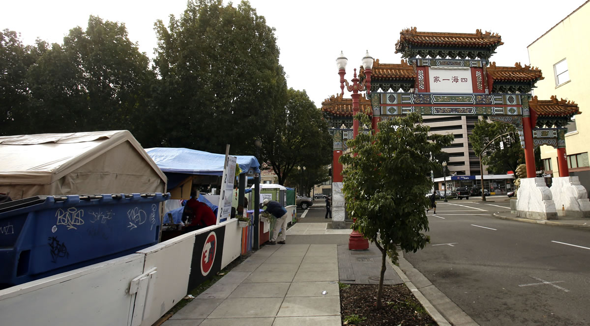 The Right 2 Dream Too homeless camp sits next to the Chinatown gate in Portland. Opponents of a city plan to put 100 people under a century-old bridge in the Pearl District are carefully choosing their words when complaining about the prospect of new, down-on-their-luck neighbors.