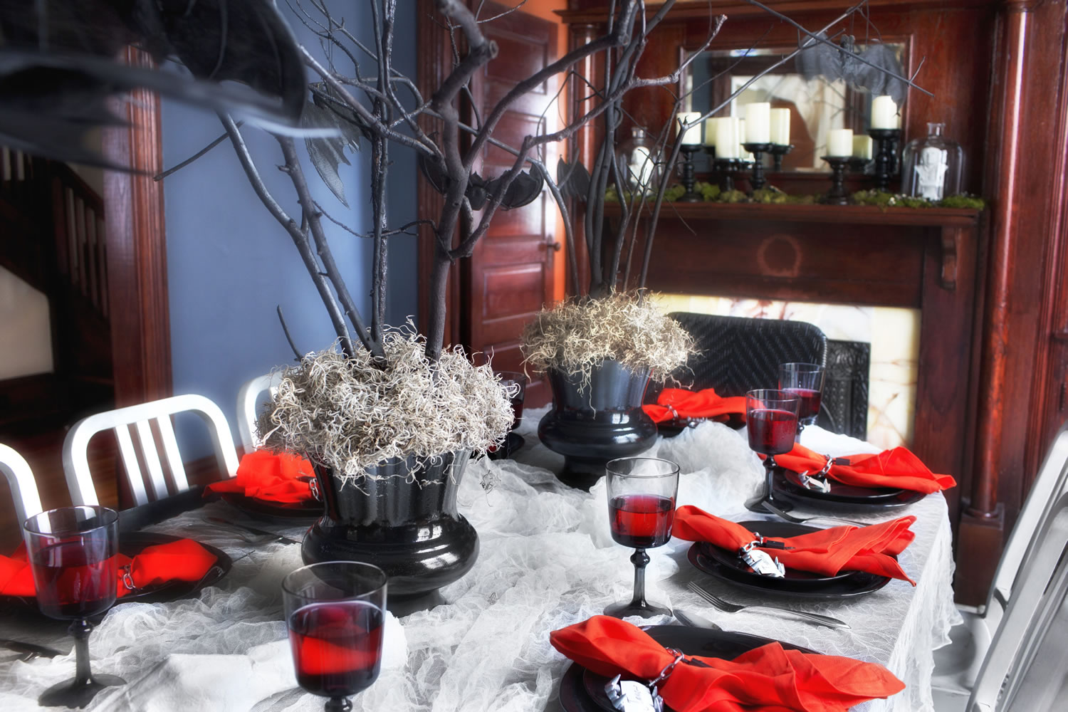 Photos by Sarah Dorio/Associated Press
Bare branches, spray-painted black and secured in vases with gravel, floral foam and a layer of moss make a stunning and inexpensive Halloween centerpiece created by designer Brian Patrick Flynn for HGTV.com.