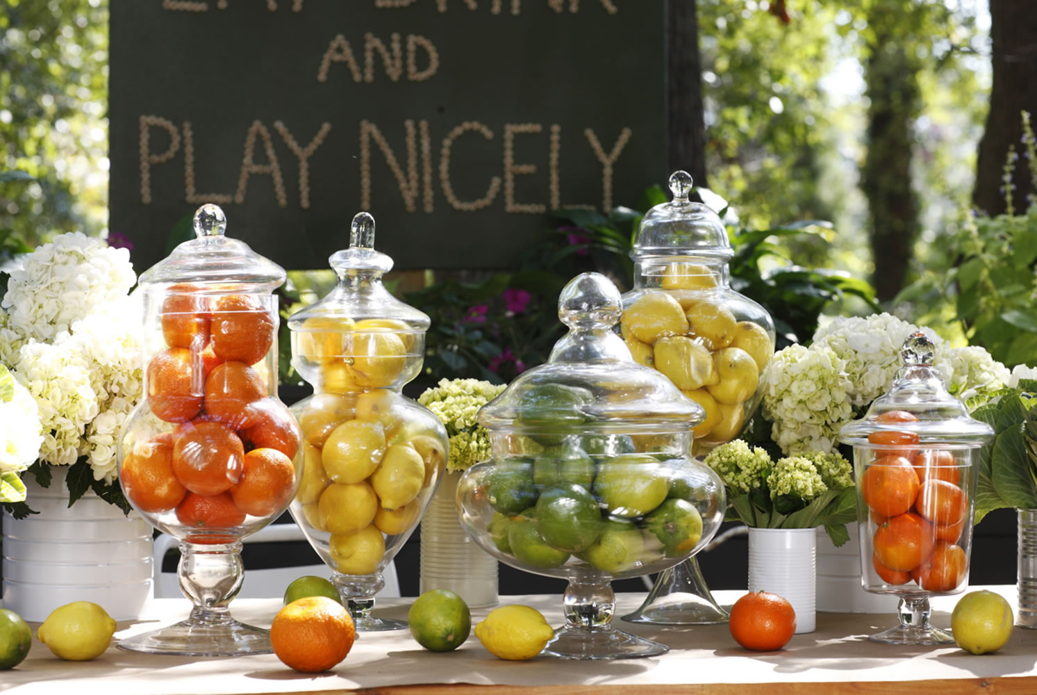 Designer Brian Patrick Flynn suggests grouping fruits in clear glass vessels.