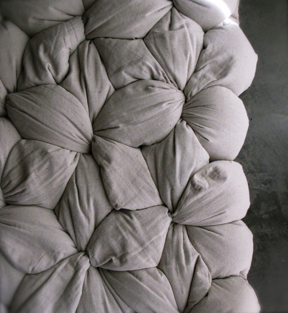 A detail of former interior designer Lynn Cimino's original Twist mattress design -- components include cotton covers and buckwheat hulls that you self-assemble by filling the covers with the hulls and twisting and tying.