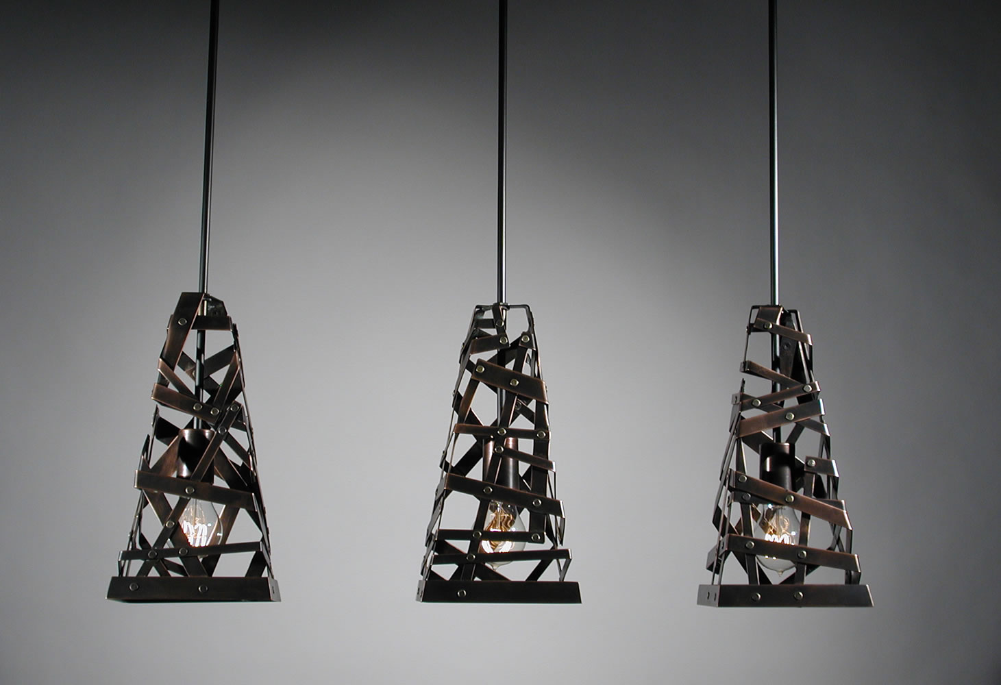 Rafael Avramovich's &quot;Harmonious Existence/Light Pendant&quot; lights of oxidized copper.