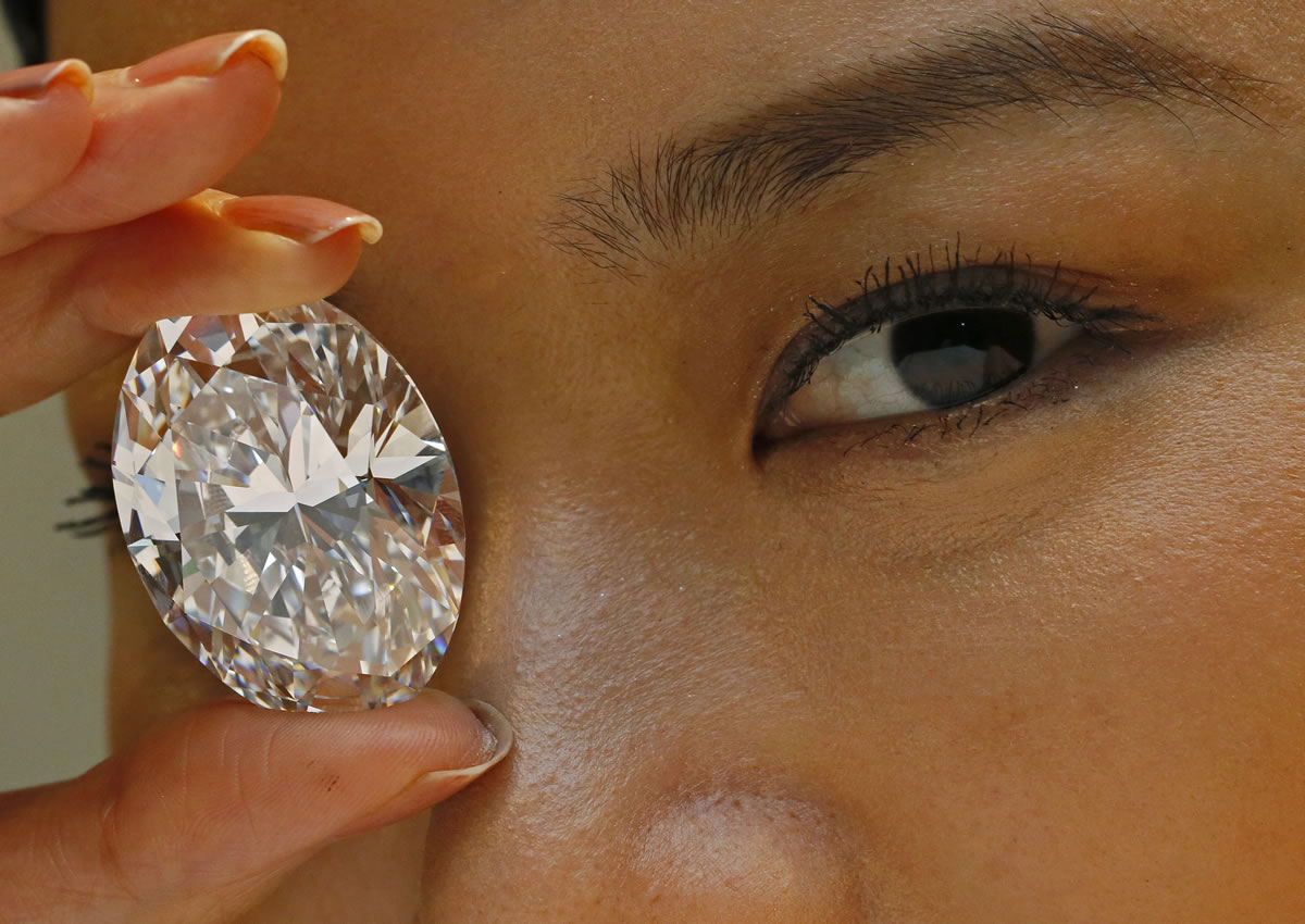 A 118.28-carat white diamond the size of a small egg sold for $30.6 million at a Hong Kong auction on Monday.