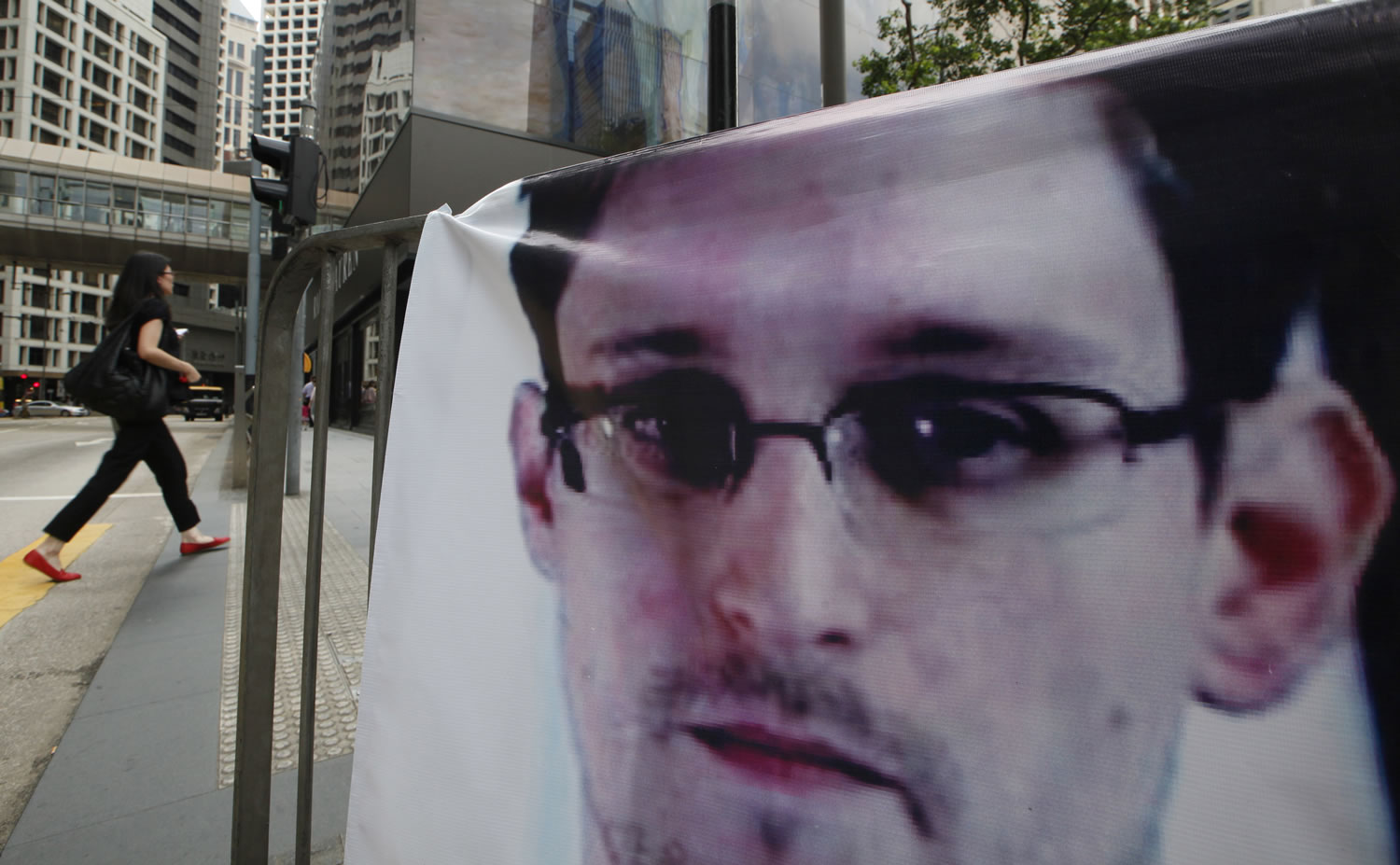 A banner supporting Edward Snowden, a former CIA employee who leaked top-secret documents about sweeping U.S. surveillance programs, is displayed Thursday at Central, Hong Kong's business district.