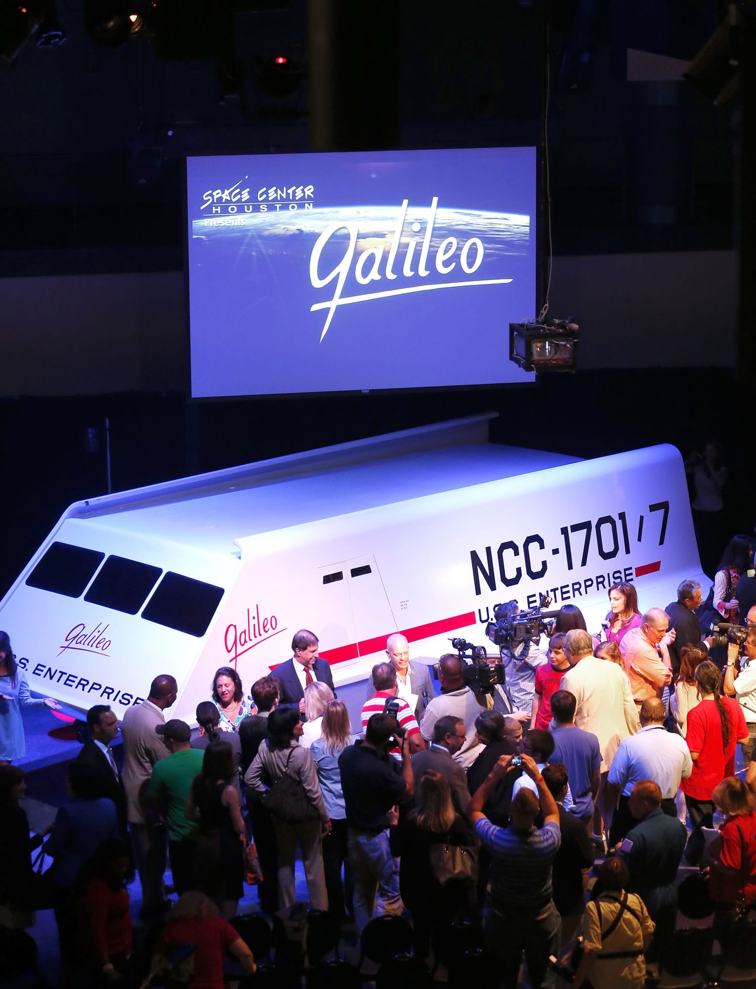 People gather around the restored shuttlecraft Galileo from the 1960s television show &quot;Star Trek&quot; as it is unveiled Wednesday at Space Center Houston.