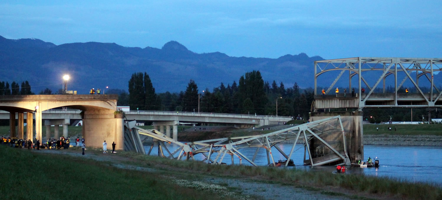 The scene were the Interstate 5 bridge collapsed into the Skagit River is seen at dusk Thursday in Mount Vernon.