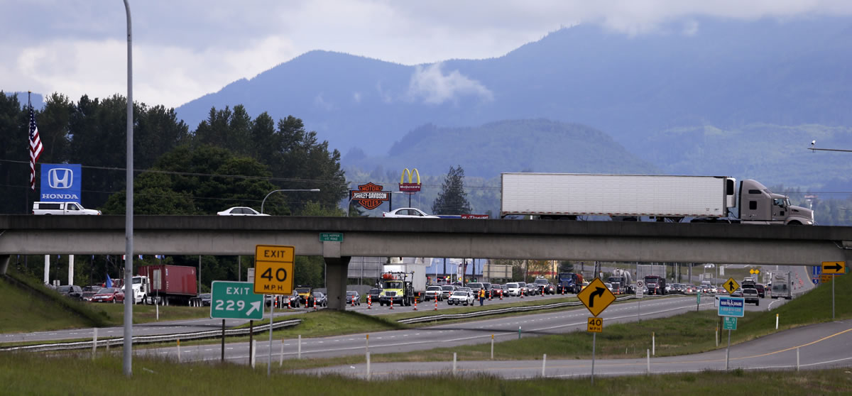 Southbound Interstate 5 traffic is routed off the highway Friday in Mount Vernon, north of the collapsed bridge at the Skagit River.