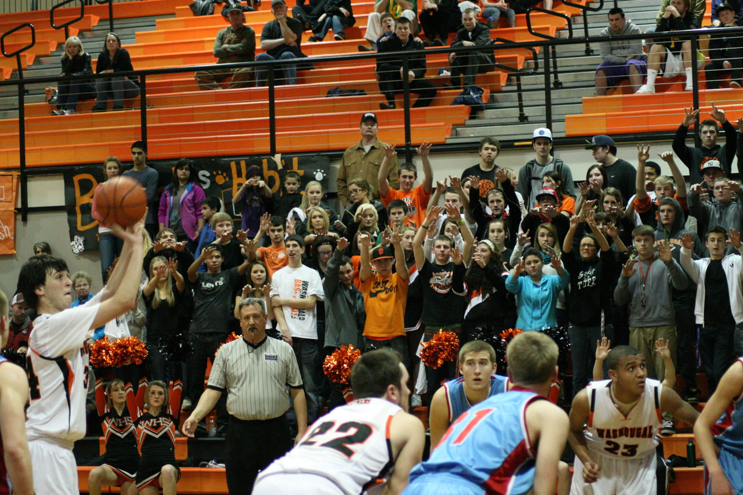 The Panther Pit Crew feels the intensity on their finger tips as Aaron Deister shoots a foul shot.