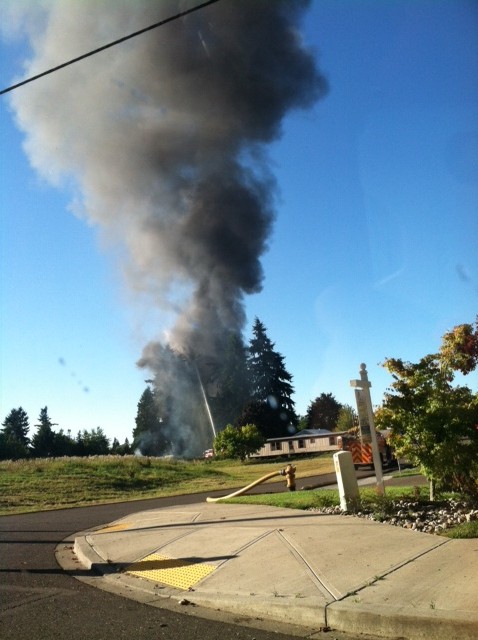 A plume of smoke pours from a fire in Felida on Friday evening.