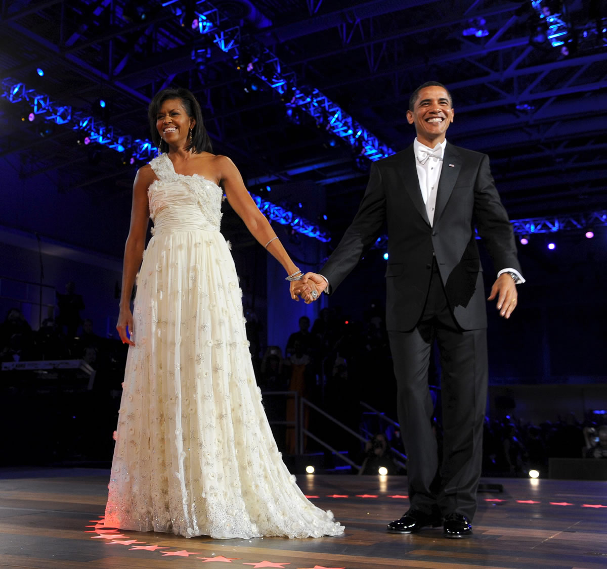 President Barrack Obama and First lady Michelle Obama enter the Neighborhood Ball for their first official dance in January 2009.