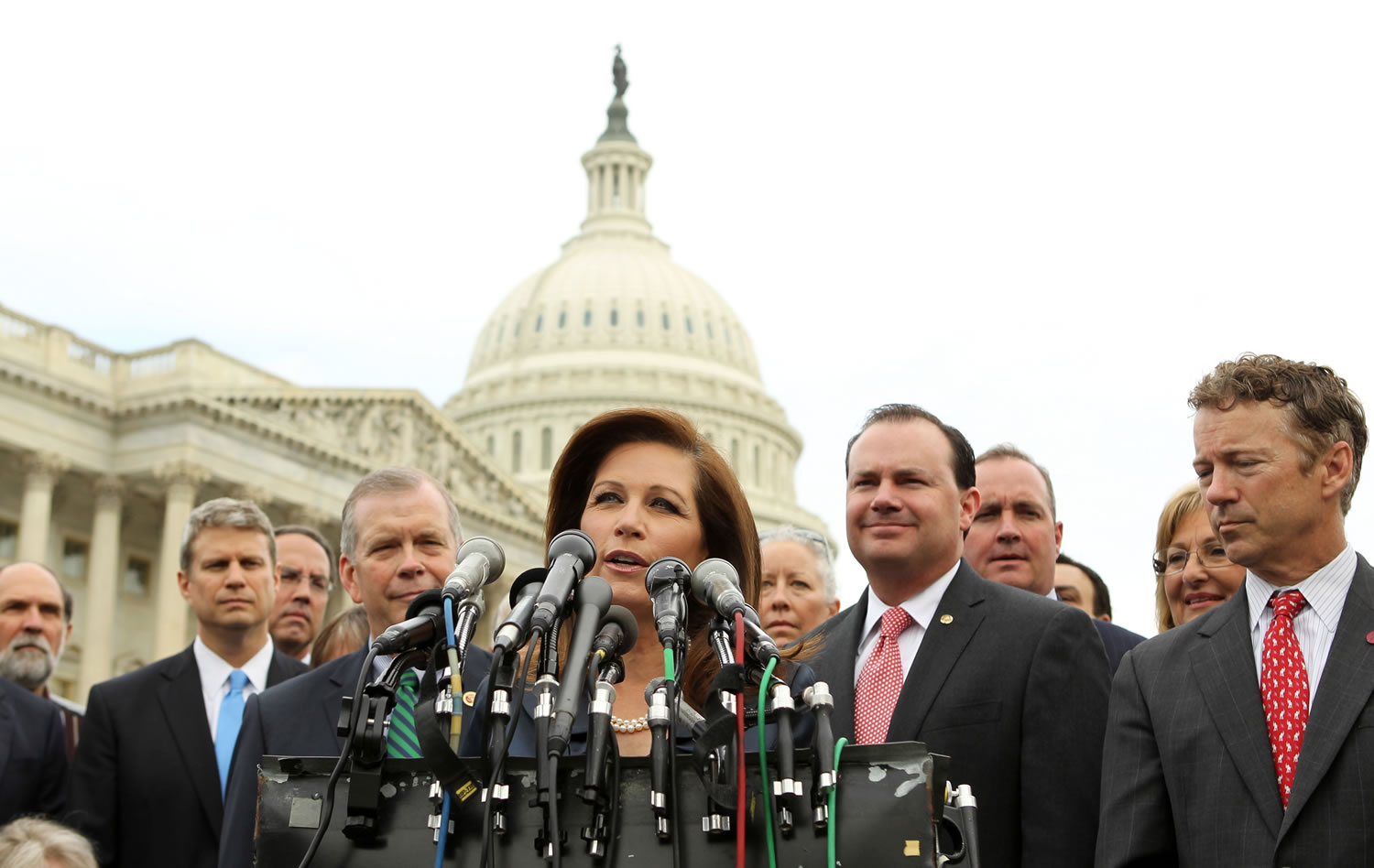 Rep. Michele Bachmann, R-Minn., chair of the Tea Party Caucus, center, speaks on Capitol Hill in Washington on Thursday during a news conference with Tea Party leaders to discuss the IRS targeting Tea Party groups. From right are, Sen. Rand Paul, R-Ky., Sen.