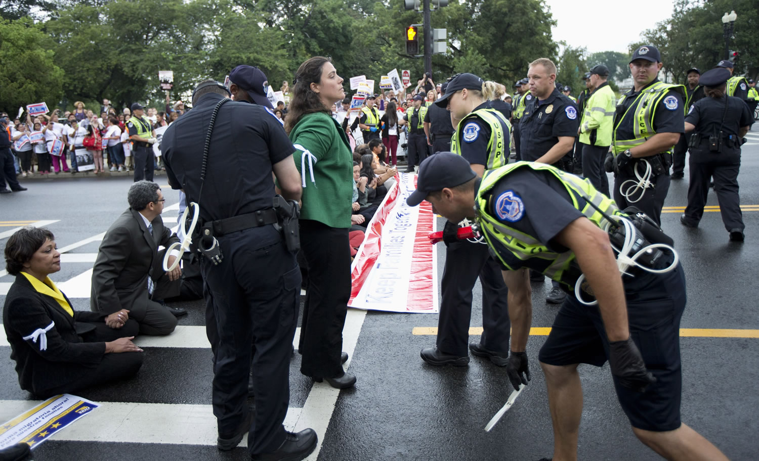 Capitol Hill police officers arrest immigration reform protestors as they blocked a street on Capitol Hill in Washington on Thursday.