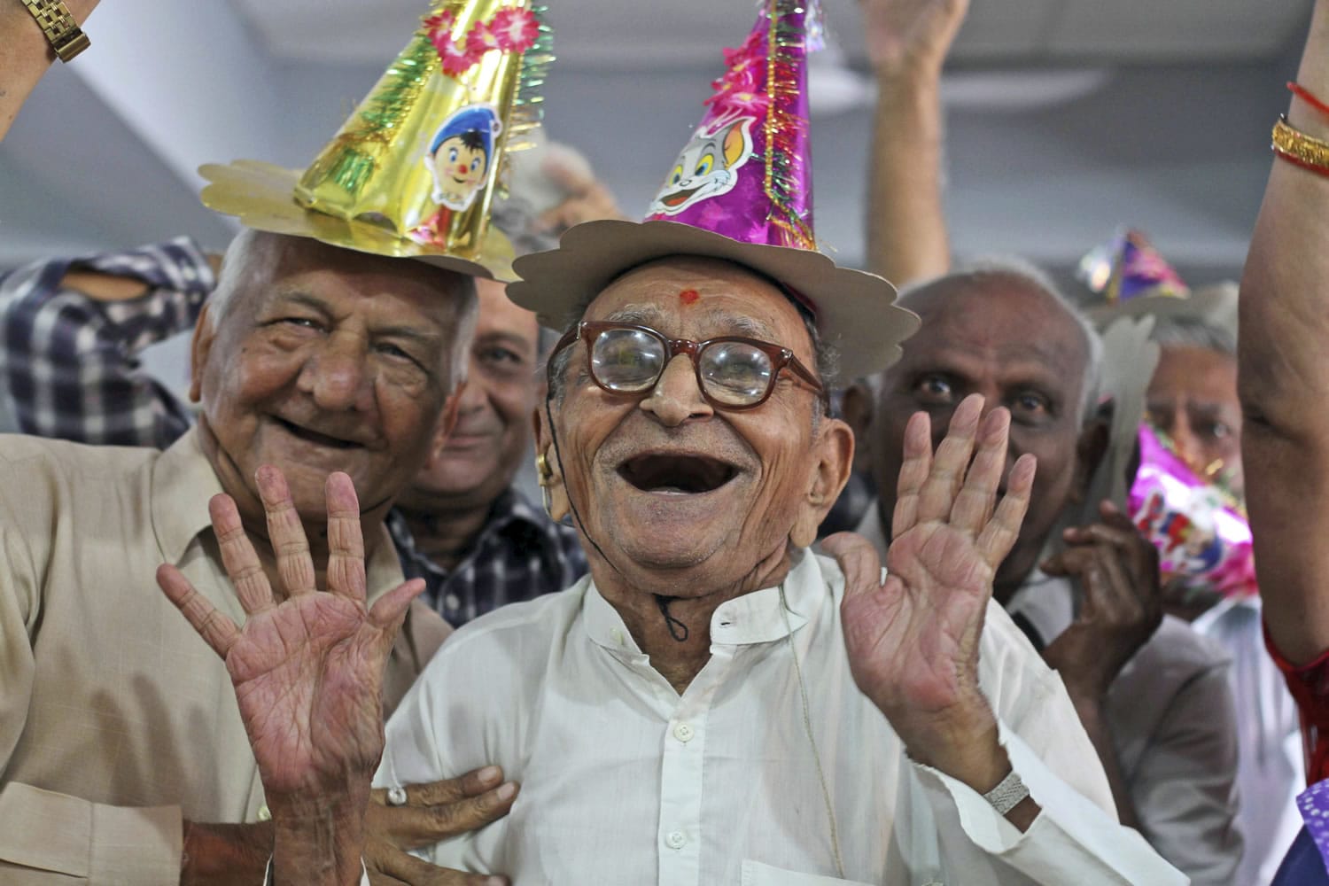 Indians participate in celebrations to mark International Day of Older Persons on Tuesday at an old-age home in Ahmadabad, India.