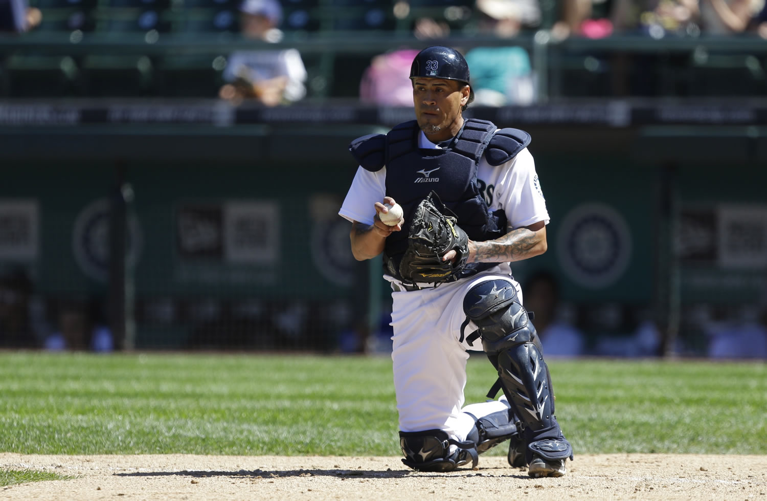 Seattle Mariners catcher Henry Blanco holds the ball in the ninth inning of a baseball game against the Cleveland Indians, Wednesday, July 24, 2013, in Seattle. The Indians beat the Mariners, 10-1. (AP Photo/Ted S.