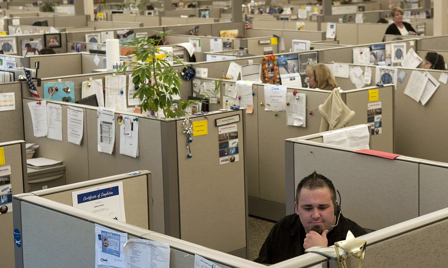 James Finch, service adviser for the US Bank Service Center, takes a call at the facility in Coeur d'Alene, Idaho.