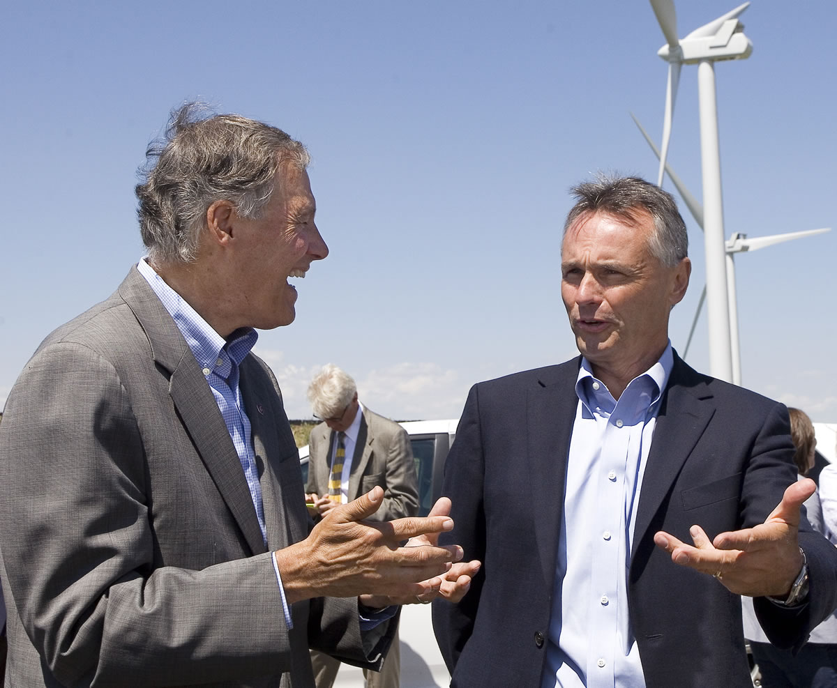 Washington Gov. Jay Inslee, left, and Scott Morris, Avista Corp. chief executive officer, talk after touring a wind turbine Monday, July 8, 2013, at the Palouse Wind project on Naff Ridge in Whitman County, Wash., between Oaksdale and US Highway 195. The Palouse Wind project uses 58 turbines to produce 105 MW of electricity.