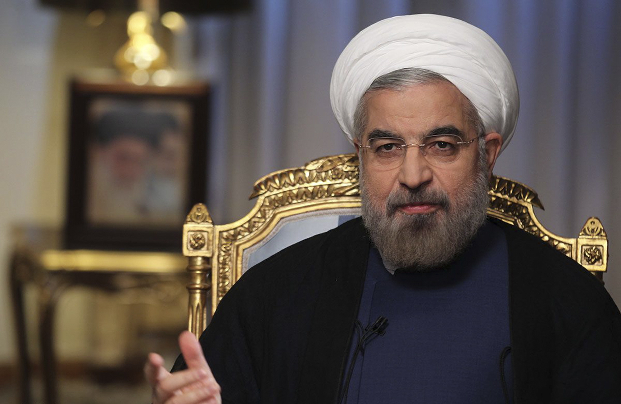 Iranian President Hasan Rouhani speaks during an interview with state television at the presidency in Tehran, Iran.