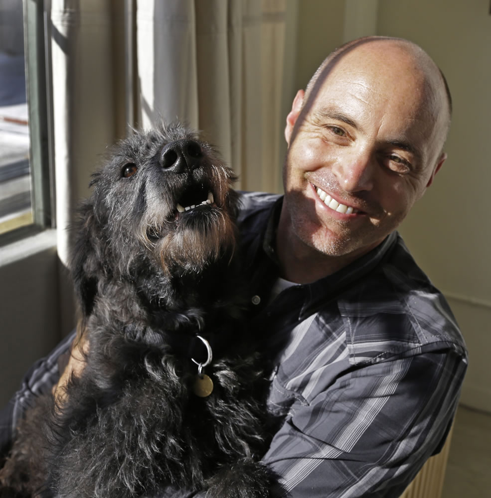 Martin Sprouse with Grady, an Airedale Terrier-Irish Wolfhound mix in Oakland, Calif. After his owner brought the dog to the Kauai Humane Society because he was moving, the dog with the big brown eyes languished for four months, said shelter operations manager Brandy Varvel.