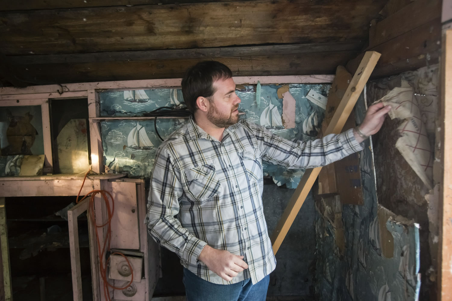 Design consultant Byron Folwell discusses the condition of and restoration work needed for the work shed at the James Castle residence in Boise, Idaho. The modest century-old home sits idle and vacant in a quiet, residential neighborhood.