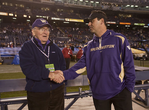 Former UW coach Don James, left and current coach Steve Sarkisian on the sideline before a recent game.