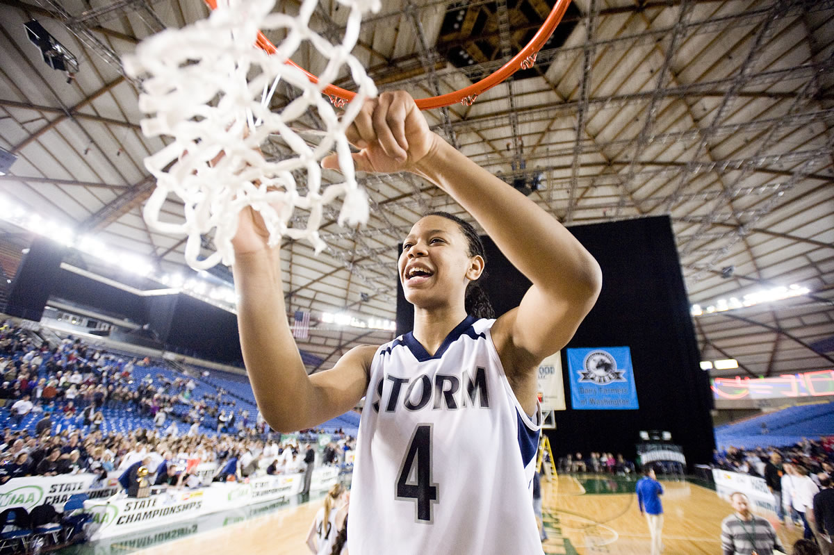 Skyview's Jocelyn Adams cuts down the net after winning the 4A Girls State Basketball Tournament in Tacoma, Saturday, March 3, 2012 Skyview beat Central Valley 46-43.