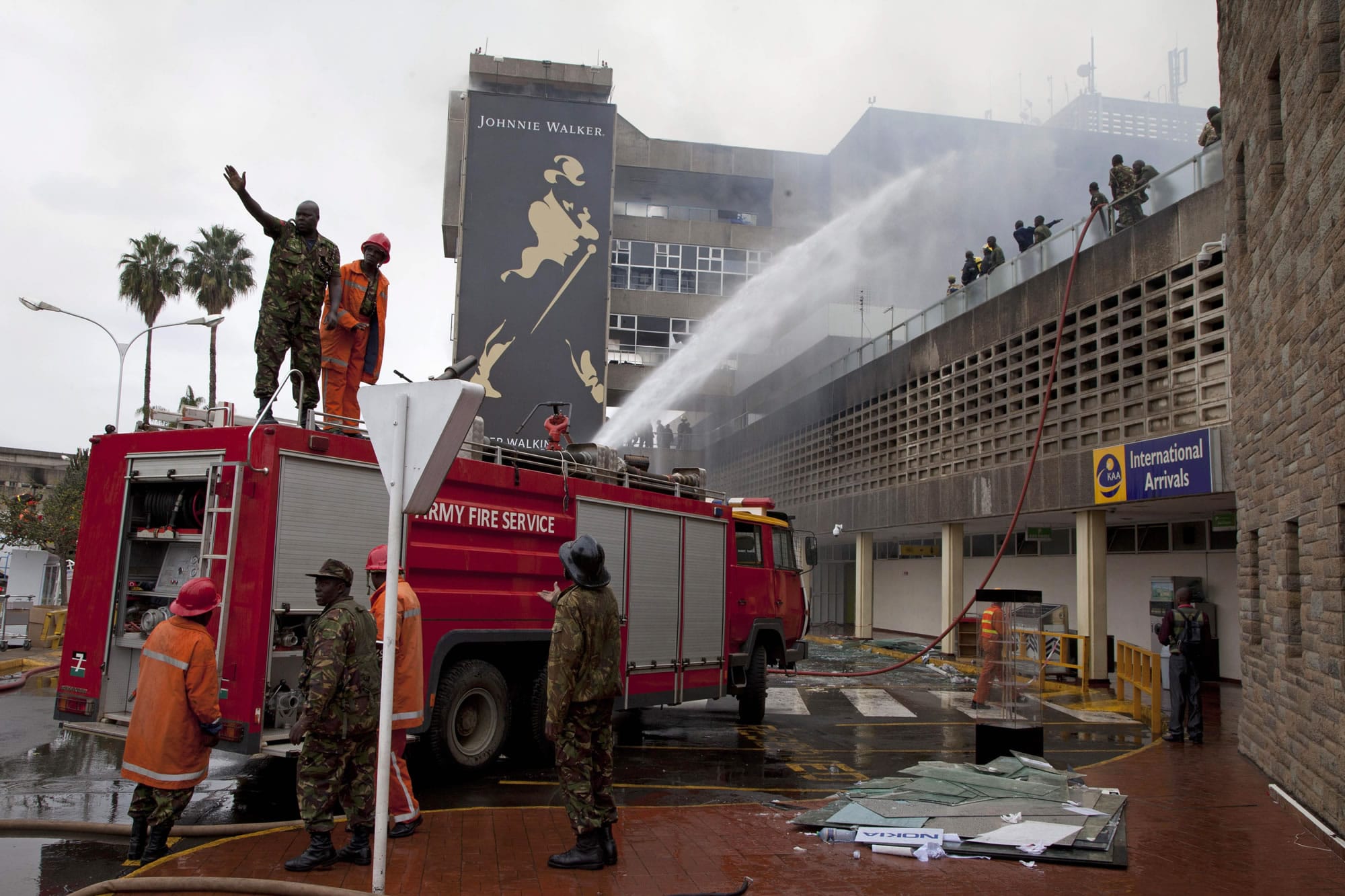 Firefighters put out the fire which gutted the International arrivals area of Jomo Kenyatta International Airport Nairobi, Kenya, on Aug.