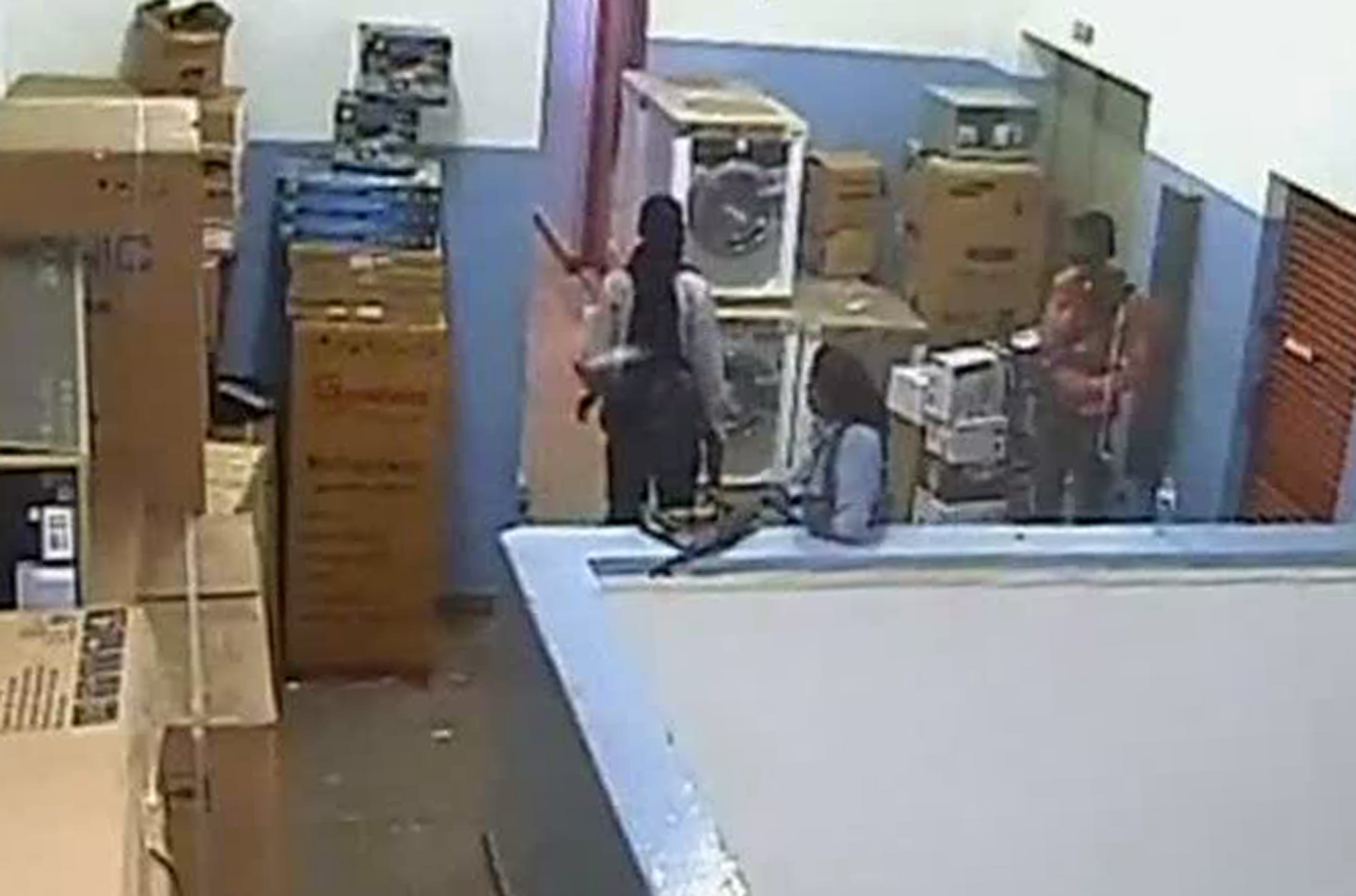 Kenyan Defence Forces via Citizen TV
In this video image made available Friday, men carrying automatic weapons and bags are seen in the storeroom of the Nakumatt shop during the four-day-long siege at the Westgate Mall in Nairobi, Kenya, that killed more than 60 people last month. A Kenyan military spokesman has confirmed the names of four attackers as Abu Baara al-Sudani, unseen, Omar Nabhan, center, Khattab al-Kene, left, and Umayr, right.