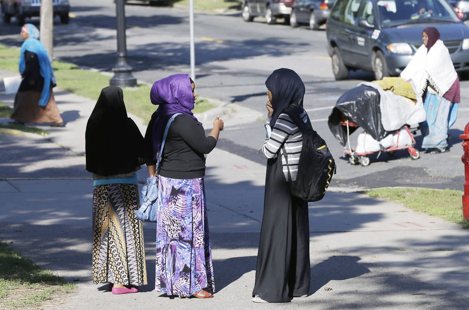 Members of the Somali community visit near a park in Minneapolis.