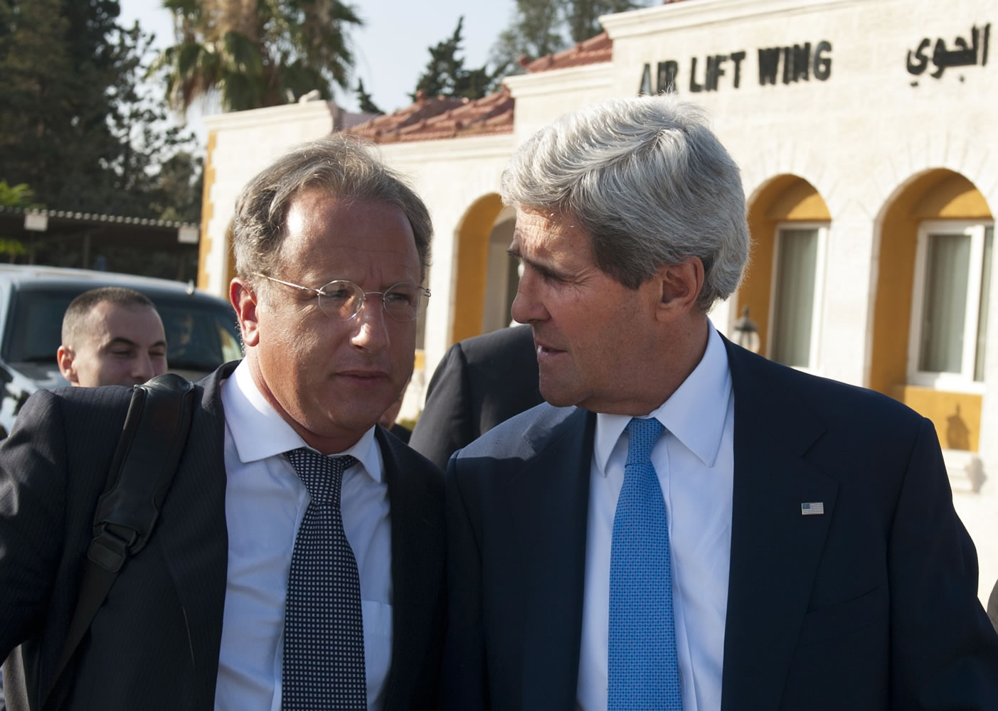 Secretary of State John Kerry, right, chats with Deputy Special Envoy for Middle East Peace Frank Lowenstein while walking to board a flight on July 19 in Amman, Jordan.