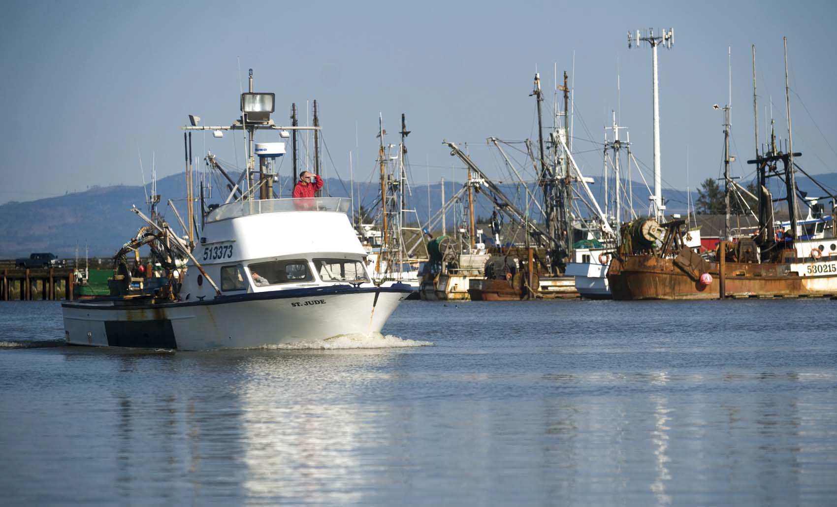 File--In this April 22, 2011, file photo, the St. Jude, a commercial fishing boat motors through the Warrenton Marina on the Skipanon River in Warrenton, Ore.  The Oregon Court of Appeals says Clatsop County can change its mind and block a pipeline that would carry natural gas to an export terminal at Warrenton.
