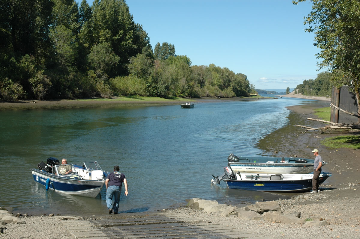 Boaters at Langsdorf Landing boat ramp access the Columbia River via the slough between Caterpillar Island and the Washington shore.